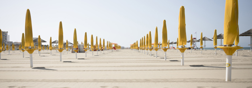 Long Shot Of Umbrellas At Resort Beach